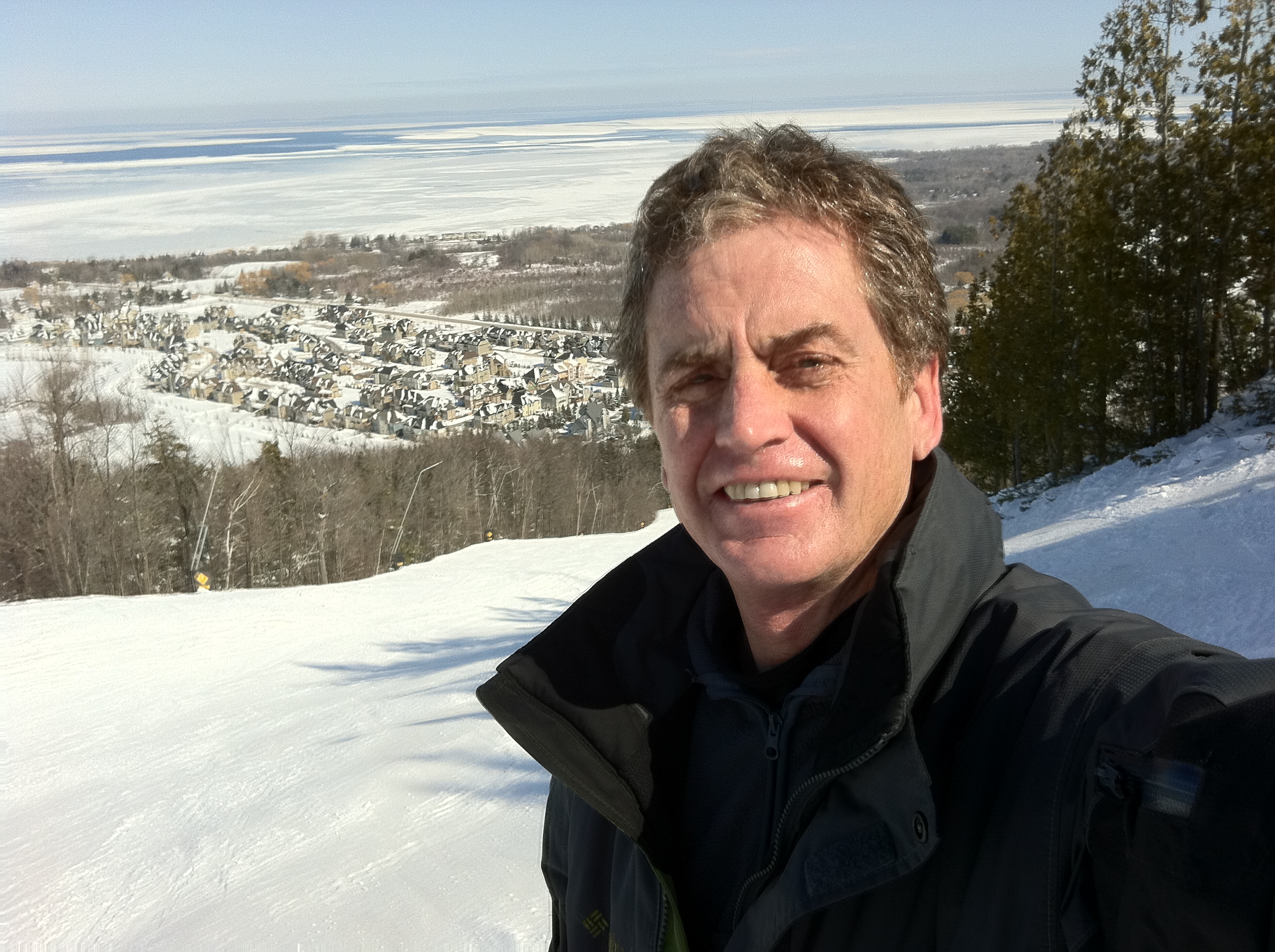 Downhill skier carving through snow